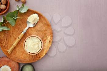 Composition with shea butter on table�
