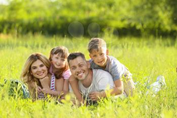 Happy family in park on summer day�