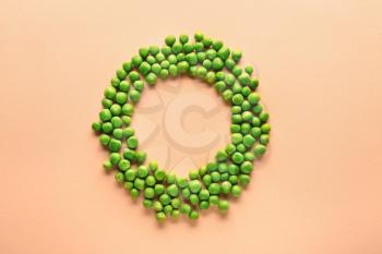 Frame made of tasty fresh peas on color background�