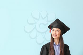 Female graduate on color background�