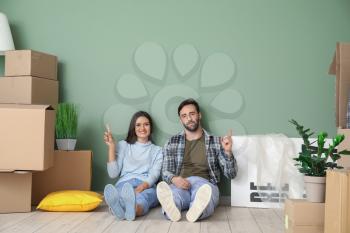 Young couple with cardboard boxes after moving into new house�