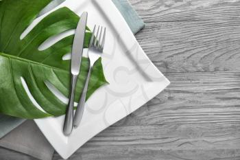 Beautiful table setting on wooden background�