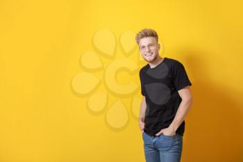 Man in stylish t-shirt on color background�
