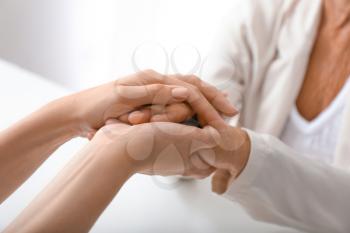 Hands of young and elderly woman. Concept of support�