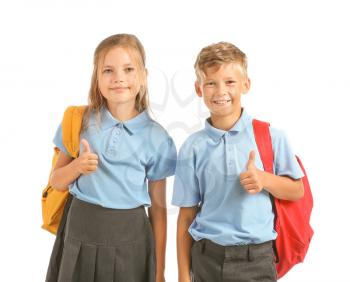 Little pupils showing thumb-up on white background�