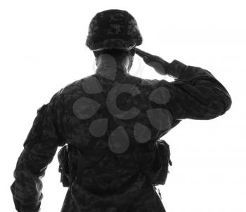Silhouette of saluting soldier on white background, back view