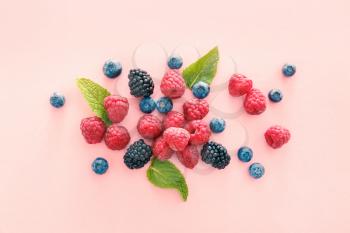 Sweet ripe berries on color background�
