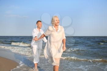 Happy mature couple at sea resort�