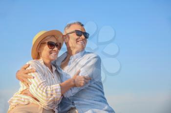 Happy mature couple at sea resort�