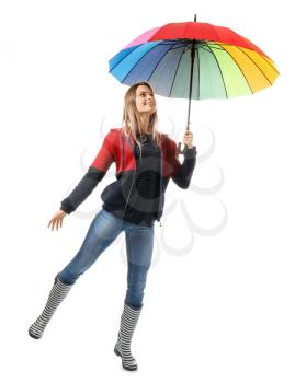 Beautiful young woman with umbrella on white background�