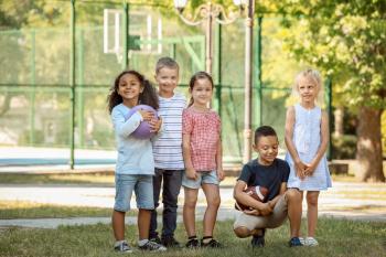 Group of cute little children in park�