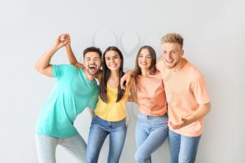 Group of young people in stylish casual clothes on light background�