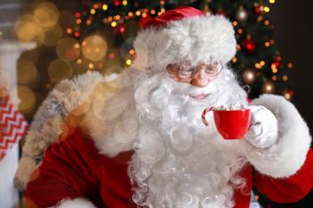 Santa Claus drinking hot chocolate on Christmas eve�