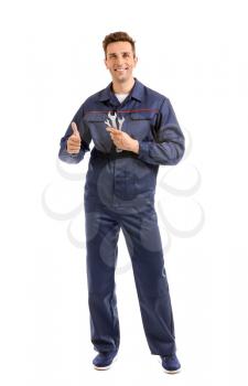 Male car mechanic showing thumb-up on white background�
