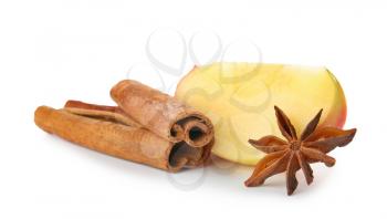 Fresh apple with cinnamon and anise on white background�