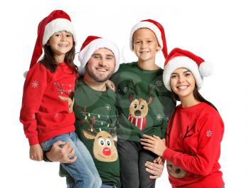 Happy family in Christmas sweaters and Santa hats on white background�