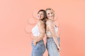 Portrait of body positive women on color background�