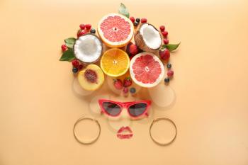 Creative composition with fresh fruits and female accessories on color background�