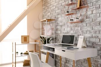 Interior of modern room with comfortable workplace�