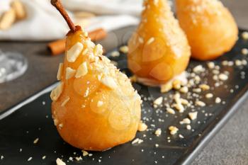 Tasty cooked pears on plate, closeup�