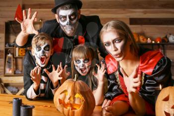 Family celebrating Halloween at home�