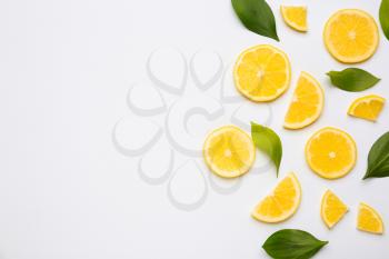 Ripe cut lemons on white background�