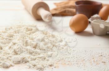 Heap of flour on table, closeup�