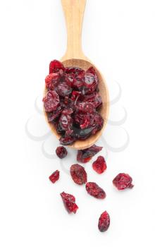 Spoon with dried cranberries on white background�