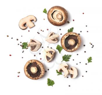 Fresh champignon mushrooms, herbs and spices on white background�