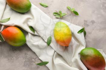 Tasty mango fruit on grunge background�