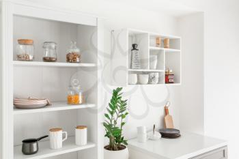 Interior of kitchen with modern shelves�