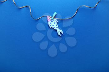 Paper fish on color background. April Fool's Day prank�