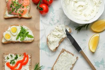 Different sandwiches with tasty cream cheese on white background�