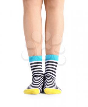 Legs of young woman in socks on white background�
