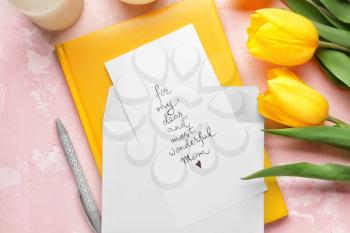 Composition with greeting card for mother on color background�