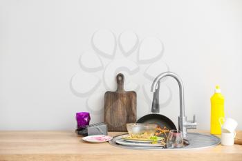 Pile of dirty dishes in kitchen�