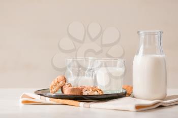 Glassware of fresh milk and cookies on table�