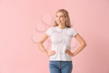 Woman in stylish t-shirt on color background�