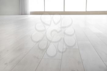 View of clean laminate floor in empty room�
