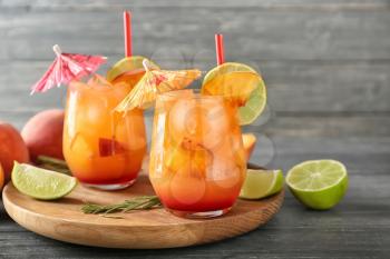 Fresh summer cocktail in glasses on wooden board�