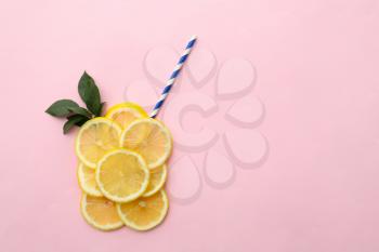 Flat lay composition with lemon slices and straw on color background�