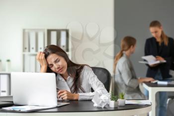 Tired businesswoman working in office�