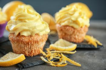 Delicious lemon cupcakes on table, closeup�