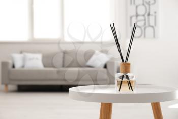 Reed diffuser on table in living room�