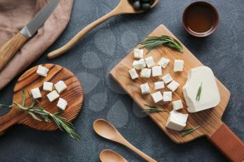 Composition with tasty cut feta cheese on table�