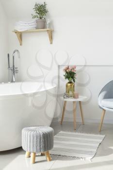 Interior of bathroom with fresh flowers�