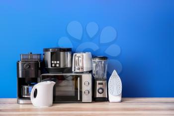 Different household appliances on table�