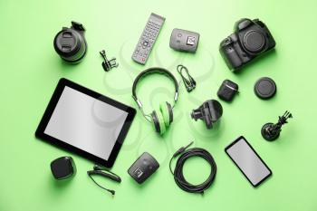 Different modern devices on color background�