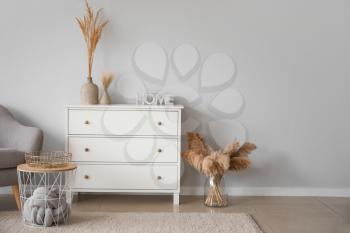 Interior of beautiful stylish room with chest of drawers�