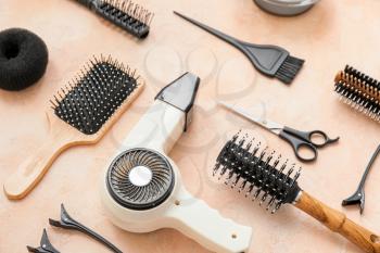 Set of hairdresser tools on color background�